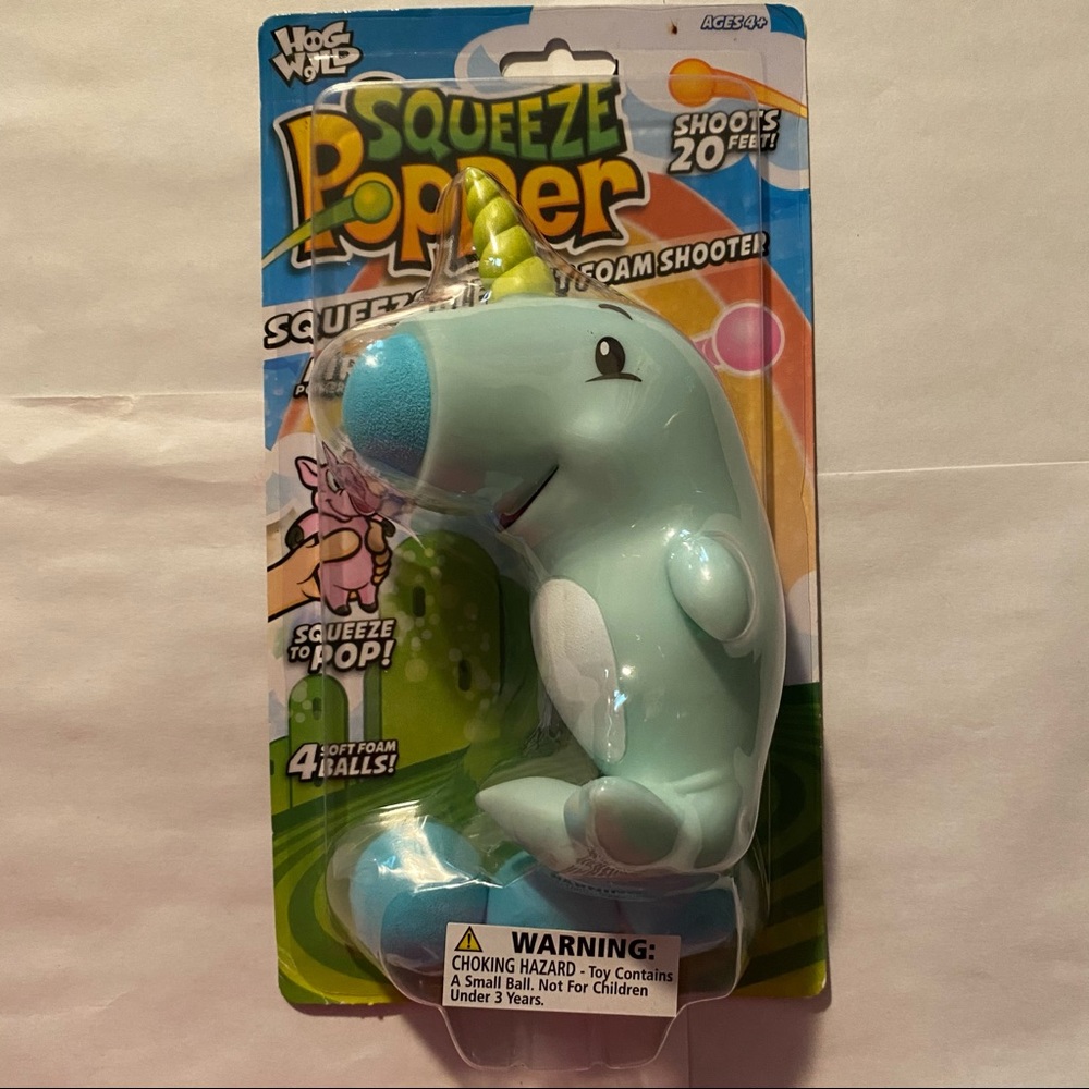 Hog Wild Squeeze Popper Narwhal Action Figure + 4 Soft Balls